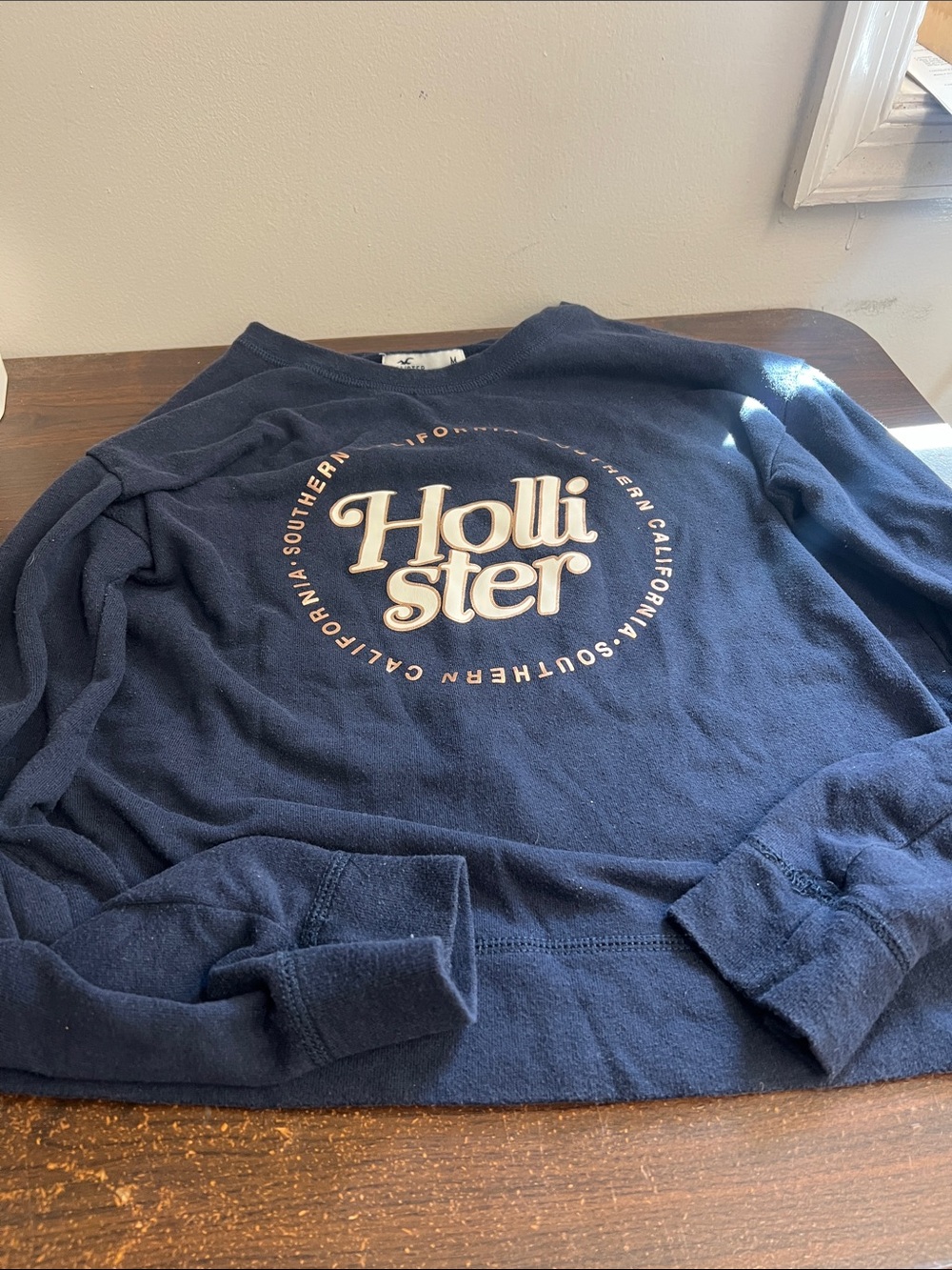 Hollister Navy Crewneck Sweatshirt with Cream Logo Circle